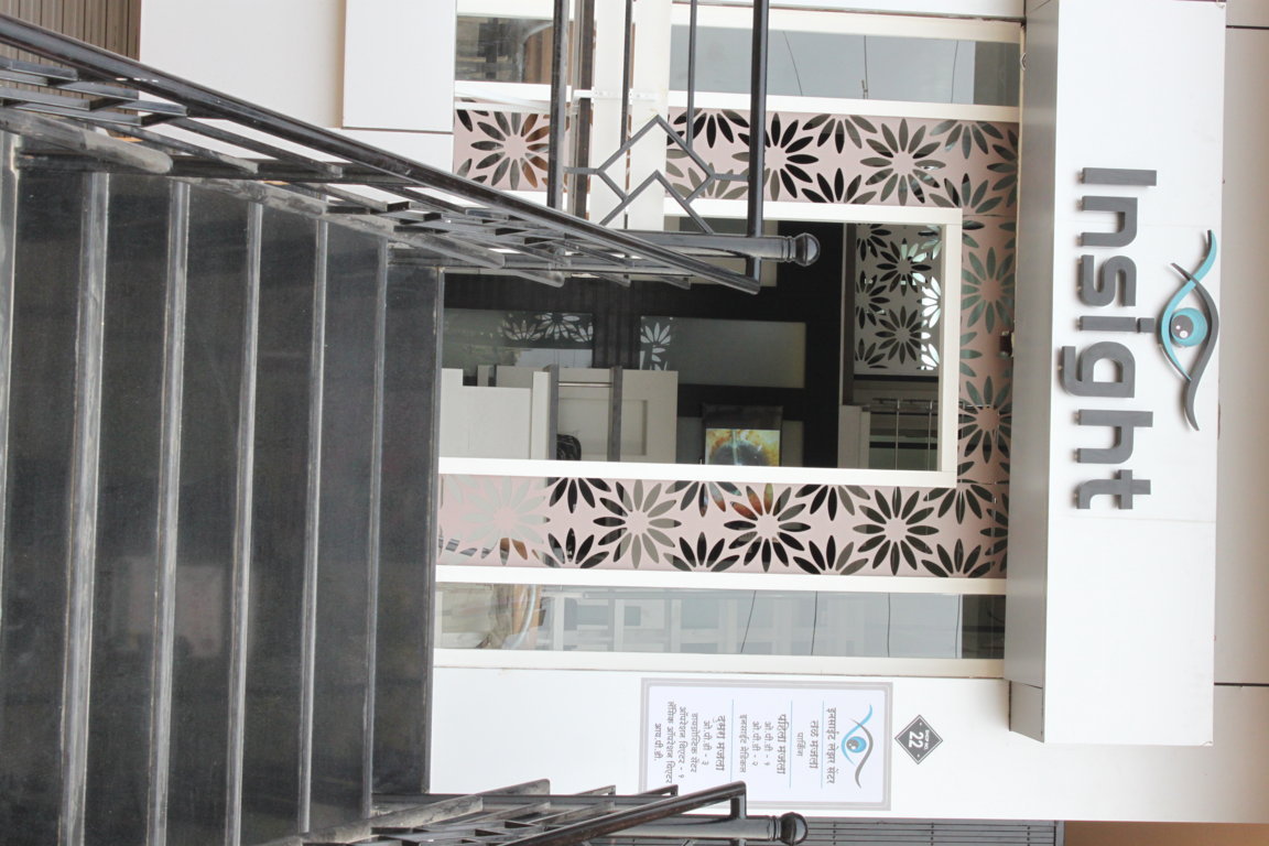 Approach stairs leading up to Insight Institute with the floral lattice façade screens framing the entry portal at the top